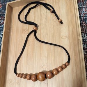 The Jones Market single cinch teething necklace in almond and black